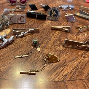 Multiple men’s cuff links, tie clips and pins